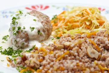 buckwheat with cutlet on plate