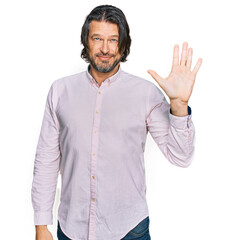 Middle age handsome man wearing business shirt showing and pointing up with fingers number five while smiling confident and happy.