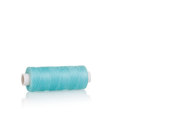 a skein of threads of blue color macro on a white background close up