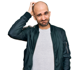 Young hispanic man wearing casual clothes confuse and wonder about question. uncertain with doubt, thinking with hand on head. pensive concept.