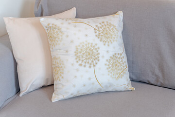 detail of small pillows on sofa