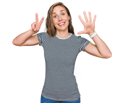 Young blonde woman wearing casual clothes showing and pointing up with fingers number seven while smiling confident and happy.