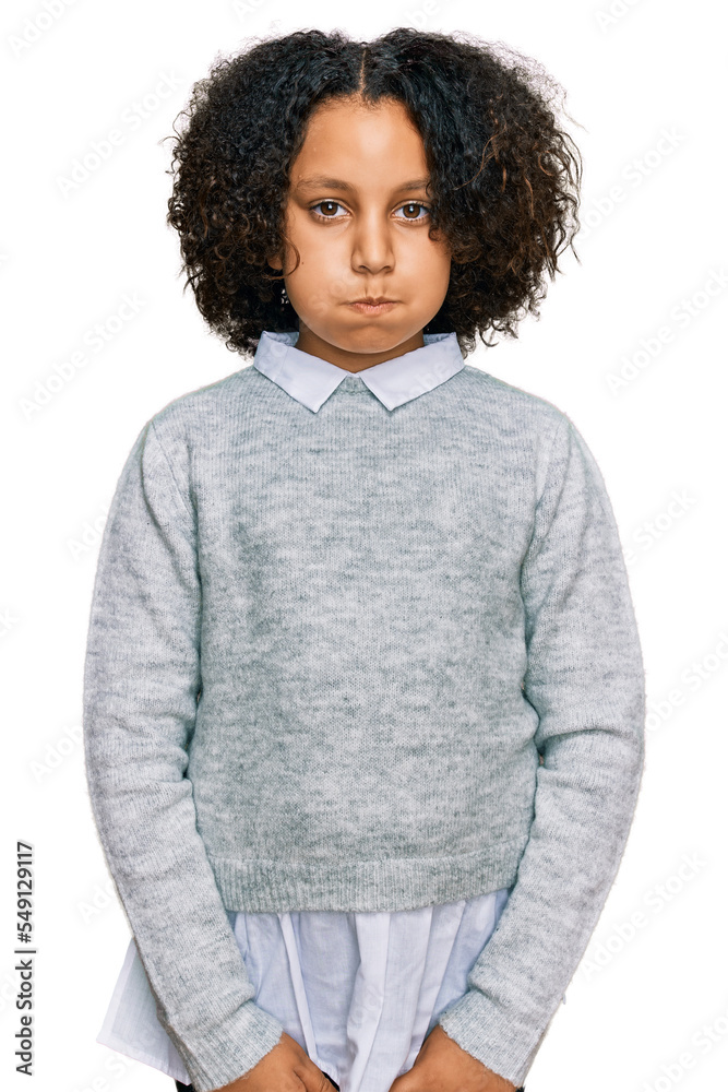 Sticker Young little girl with afro hair wearing casual clothes puffing cheeks with funny face. mouth inflated with air, crazy expression.