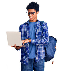 Young african american man holding student backpack using laptop looking positive and happy...