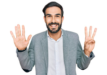 Young hispanic man wearing business clothes showing and pointing up with fingers number eight while smiling confident and happy.