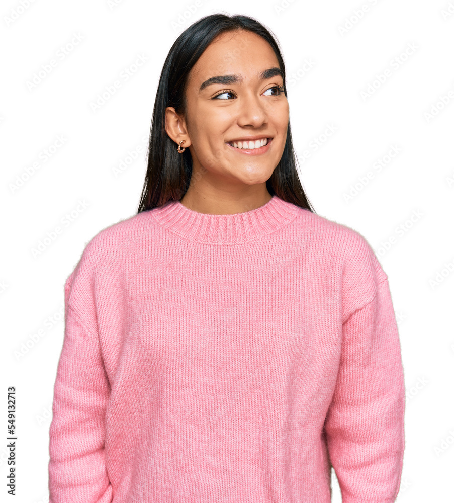 Sticker young asian woman wearing casual winter sweater looking away to side with smile on face, natural exp