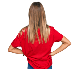 Teenager caucasian girl wearing casual red t shirt standing backwards looking away with arms on body