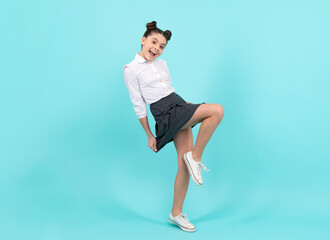 Amazed teenager. Full length overjoyed teenager kid girl 12 13 14 year in casual wear jumping old...