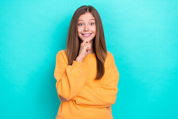 Photo of young cute cheerful toothy beaming smile lady teen age touch chin genius idea solution homework isolated on aquamarine color background