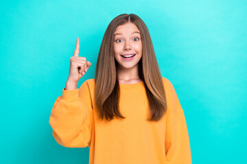 Photo of young cute little teenager girl finger point up genius idea how get first place science competition isolated on cyan color background