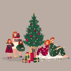 Happy family with kids around the Christmas tree