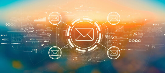 Email concept with blurred cityscape at sunset or sunrise