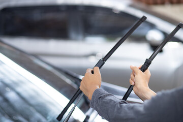 Technician replacing windshield wipers change car wiper blades - obrazy, fototapety, plakaty