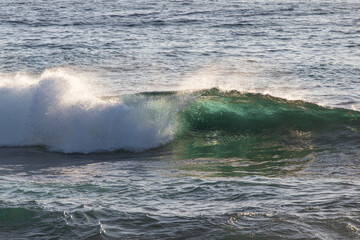 Wave barrel breaking in the ocean.