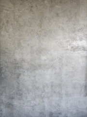 Vertical shot of gray concrete wall. Concrete floor. For background. vintage plaster wall copy space for text Smooth plaster walls inside the building
