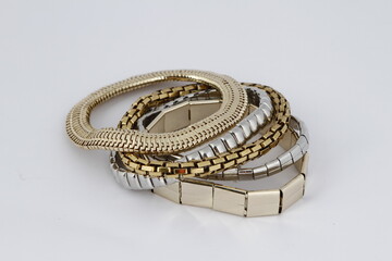 Various gold and silver metal bracelets