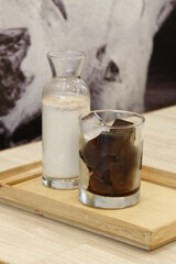 Unmixed iced coffee—warm milk and coffee ice cubes