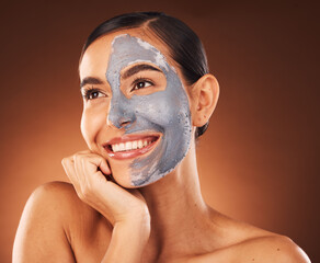 Face, beauty skincare and woman with clay mask in studio isolated on a brown background. Makeup,...