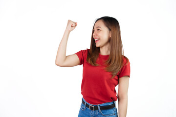 Obraz na płótnie Canvas Pretty Asian people wearing red t-shirt for a woman isolated on white background. Successful young woman achieve goal or prize, raising hands up and scream yes with joy and excitement.