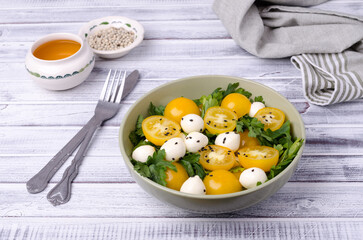 Yellow tomatoes, mozzarella and parsley