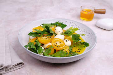 Yellow tomatoes, mozzarella and parsley