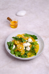 Yellow tomatoes, mozzarella and parsley