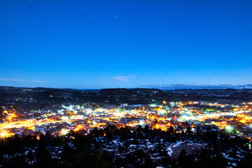 winter night in town, bright lights and snow in the mountains, creel chihuahua