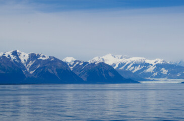 snow covered mountain range and coastline in Alaska