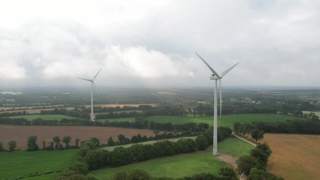Timelapse drone view of wind turbine with stunning clouds mouvement in the morning