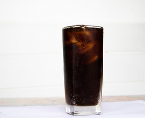 glass of cola with ice