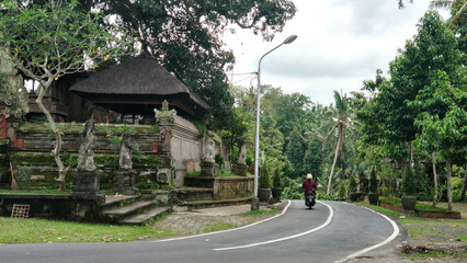 A picturesque road on the island of Bali. The mysterious trails of a fairy-tale island