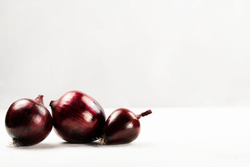 Red onion on a light background close-up