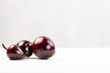 Red onion on a light background close-up