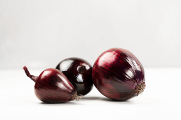 Red onion on a light background close-up