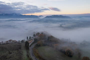 Aerial view of foggy morning in Marche region in Italy