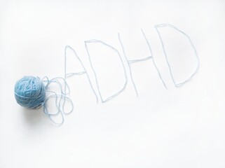 the inscription ADHD and a clew yarn on a white background. therapy for children with ADHD, neurodivergent children, learning difficulties in ADHD, neuropsychology