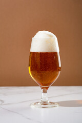 Overflowing beer foam craft alcohol background
