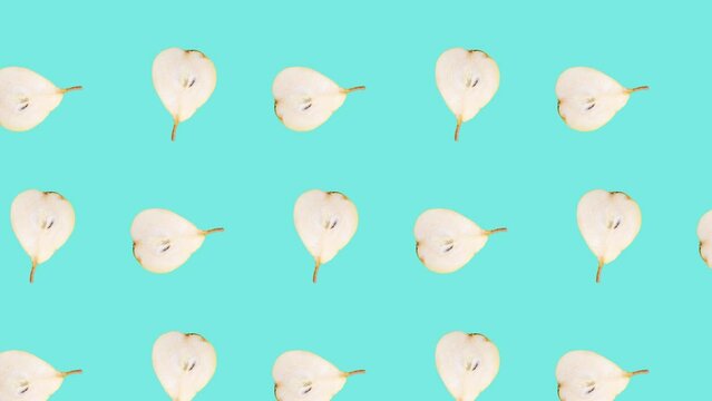 Pear slices in seamless loop pattern on a light blue background. Exotic fruits in seamless loop animation. Endless food motion graphic background