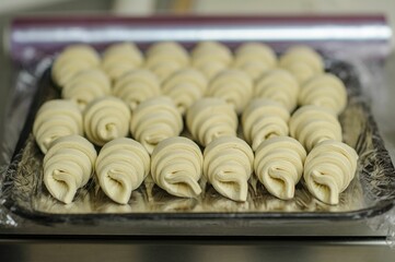 Closeup of making croissants in a bakery
