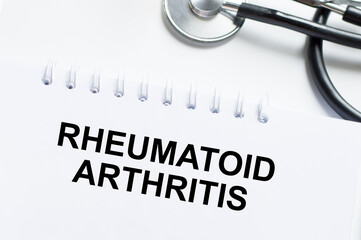 RHEUMATOID ARTHRITIS, text on white paper near stethoscope