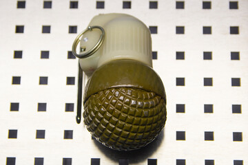 Fragmentation, combat grenade in green color close-up