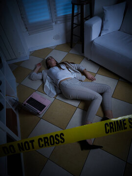 young woman lying dead on the floor after rape - crime scene