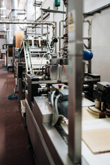 Fototapeta na wymiar Huge factory line for sweet food and cookies production. Conveyor belt waffle production line.production line.