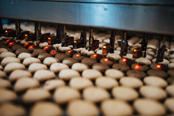 Huge factory line for sweet food and cookies production. Close up shots of industrial manufacturing...