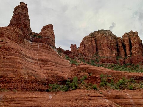 Red Rock Formations Against A Gray Overcast Sky