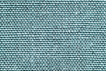 Blue fabric texture. Closeup textile background. Apparel clothes. Casual wear. Knit pattern. Warm winter fiber material. Cotton background. Plain cloth background.	