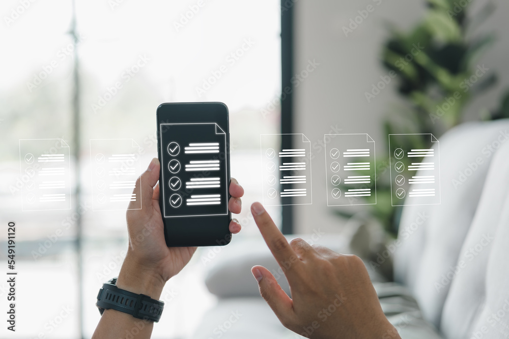Poster A businessman works with a smartphone. Check marks in the check boxes successful completion of business tasks. Digital marketing statistics. Business management is the goal of strategy.