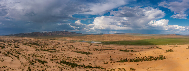 Fototapeta na wymiar Sand dunes of desert and mountains