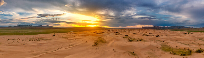 Fototapeta na wymiar Sand dunes in desert at sunset