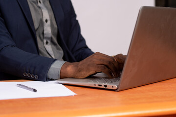 person typing on a laptop computer